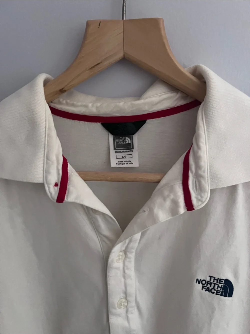 The North Face Men's off white/ cream colored Polo with Red Collar Trim
